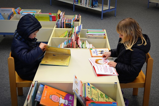 boy and girl with books in a library