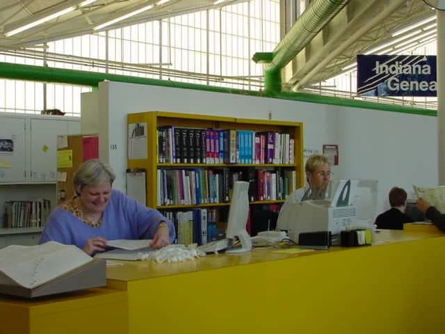 two people at reference desk