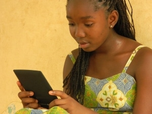 girl holding tablet or ereader