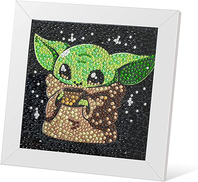 an image of baby yoda is made from small gems and set in a white frame