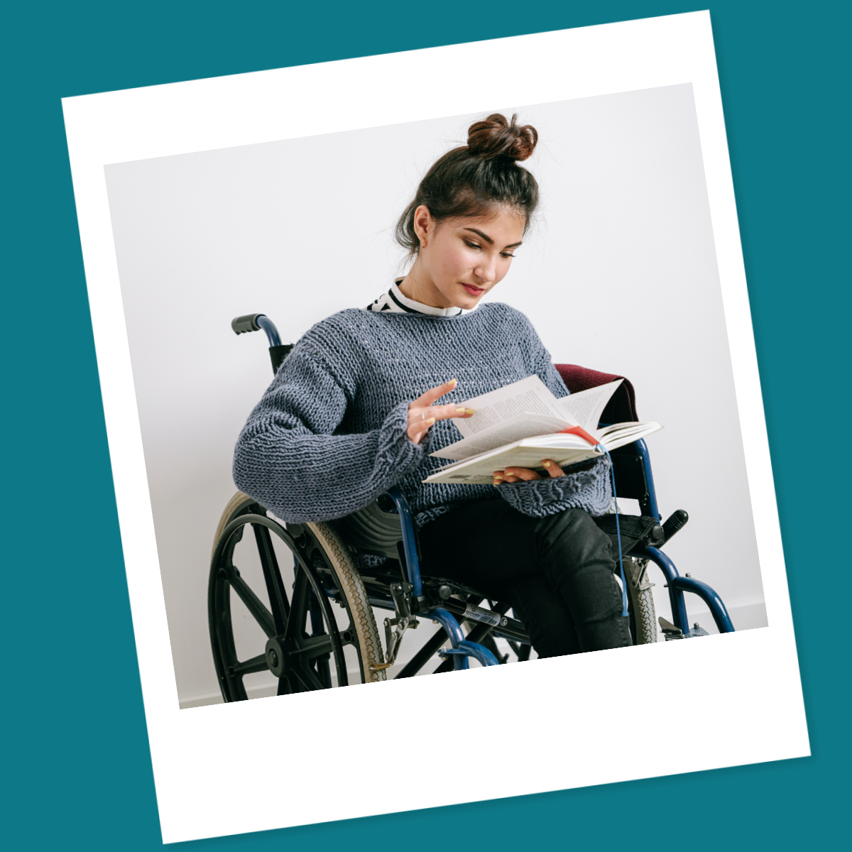 woman in wheelchair reading book